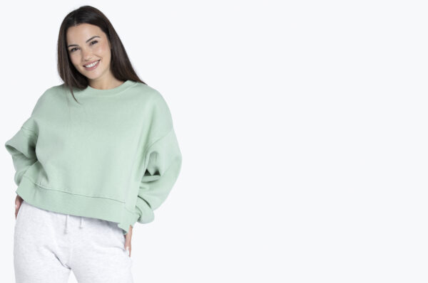 a girl wearing blank crewneck sweatshirts and smiling