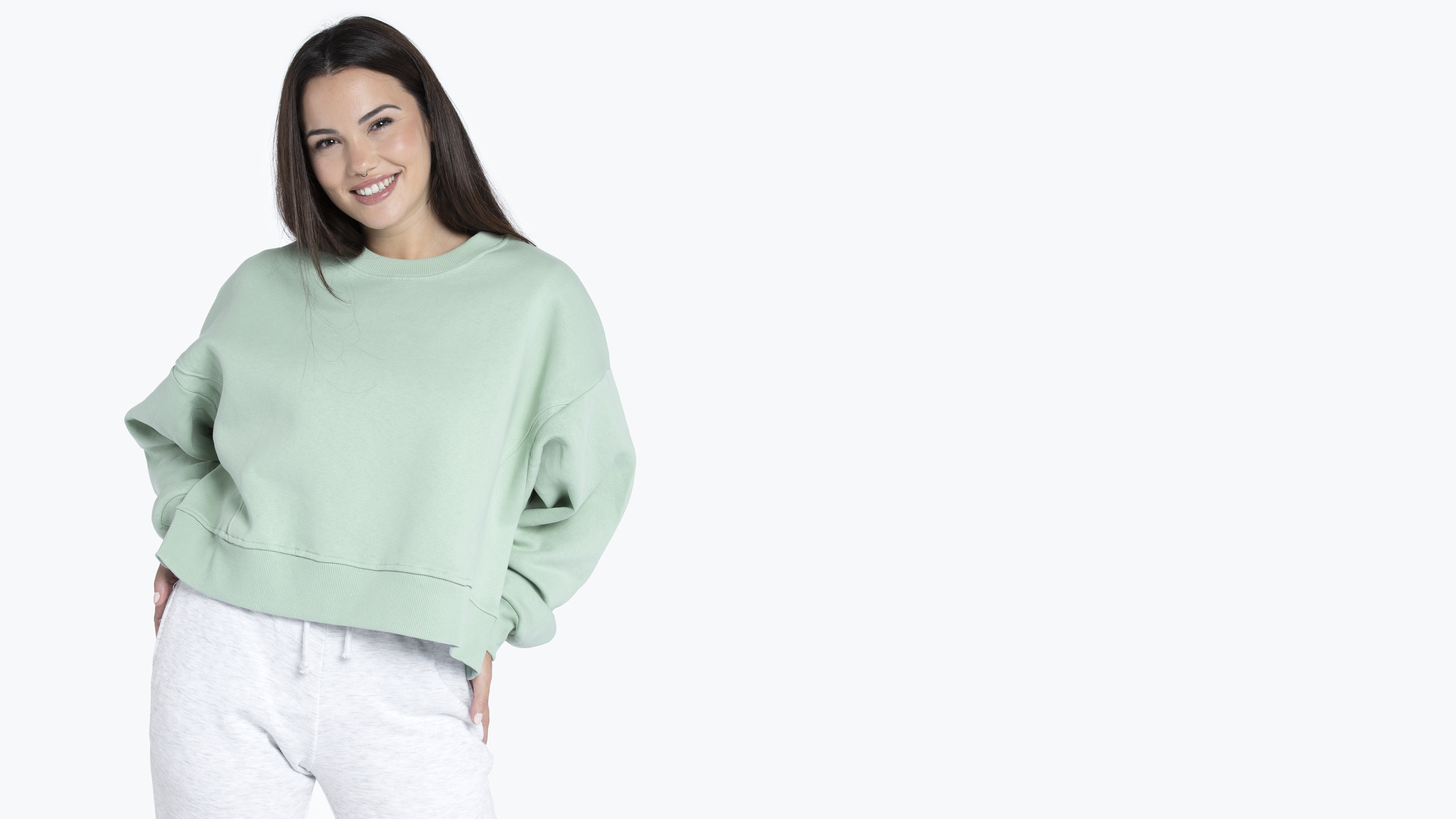 a girl wearing blank crewneck sweatshirts and smiling