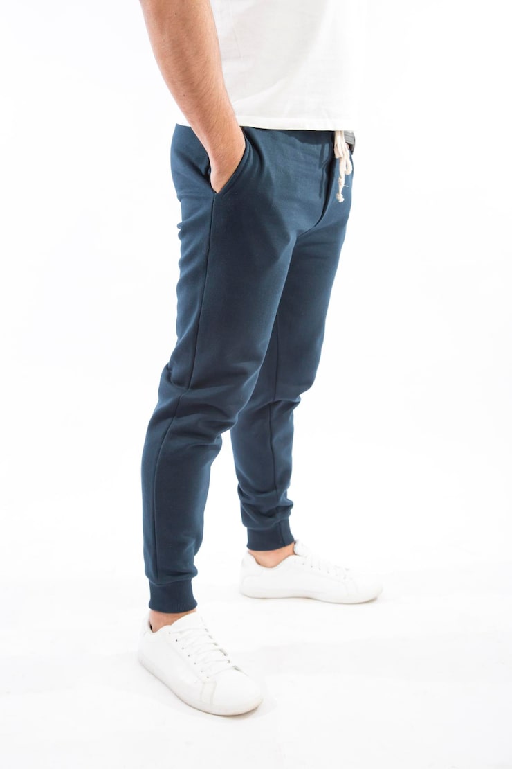 a man standing wore a green wholesale joggers